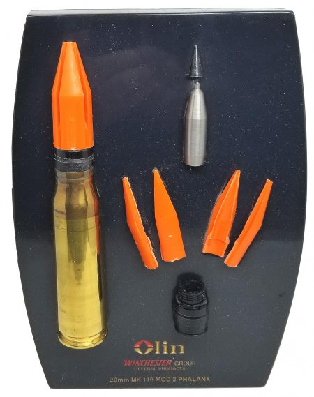 Lot 107 - Factory display of 20mm MK 149 Mod 2 Phalanx cartridge with cut-a-way penetrator and orange sabot. Mounted on black marble. Olin Winchester Group Defense Products. Ex-Woodin collection. $225-275