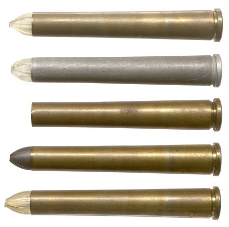 Lot 119 - A group of five different 9.53mm Multiple Flechette cartridges. Aluminum case, cleasr plastic sabot (from 20-round box marked “Tracer.” Headstamp: “WRA 70;” Brass case, 4-segment gray sabot, “WCC 70;” Brass case, pointed slightly yellow sabot, “WCC 70;” Brass case, clear plastic sabot, “WCC 70;” and a brass case unprimed empty, “Å WCC 69.” HWS Vol. III, page 428, Fig. 633. Ex-Woodin collection. $250-325