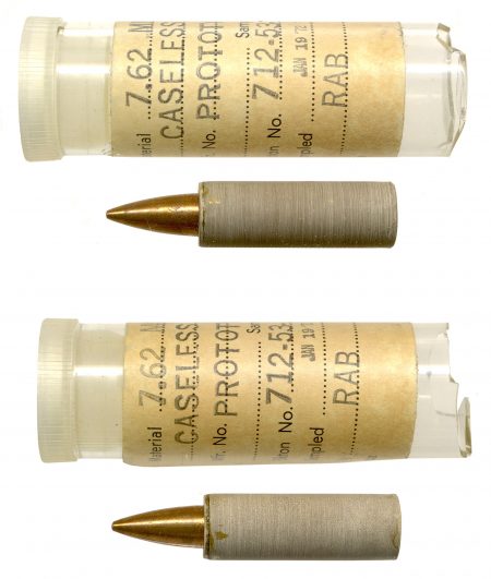 Lot 141 - A pair of Thiokol “7.62MM CASELESS PROTOTYPE” cartridges using tan-colored molded propellant charges Padded, in vials (broken bottoms) with labels. January 19, 1972. Vol. III, page 361. Ex-Woodin collection. $250-325