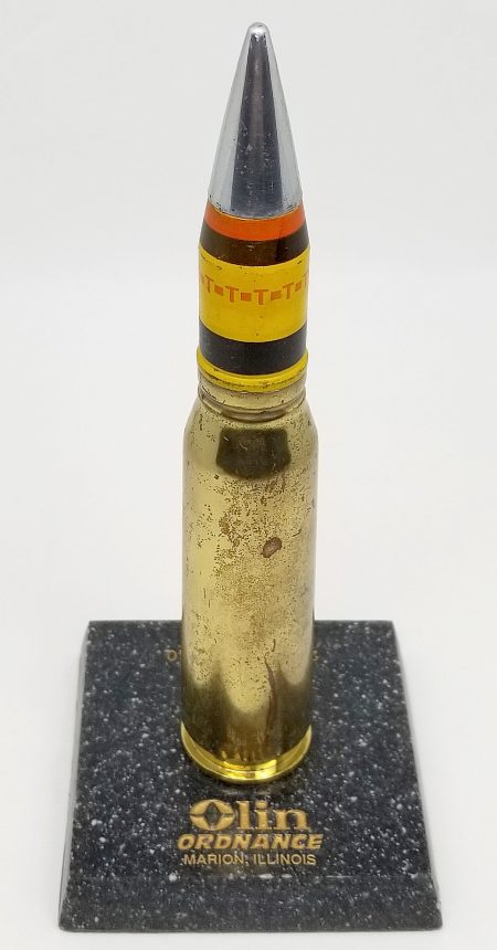Lot 147 - Olin Ordnance, Marion, Illinois display of a 20mm PGU M940 cartridge. Mounted on a marble display base. Ex-Woodin collection. $135-165