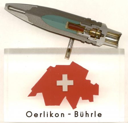 Lot 3 - Swiss clear Lucite block “Oerlikon – Bührle” with sectioned PLA 224 SAPHEI-T (semi-armor piercing high explosive incendiary – tracer) 20mm projectile mounted on top. Ex-Woodin collection. $75-130